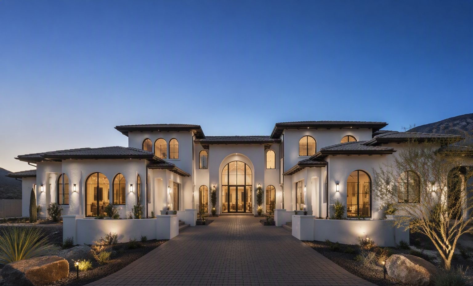 Custom home with smooth white stucco at dusk in Pasco, WA